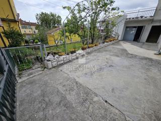STANOVANJE Z GARAŽO IN VRTOM, MIRNA LOKACIJA