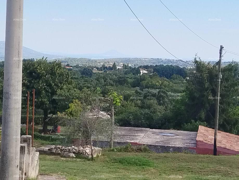 Građevinsko zemljište s pogledom na more i postojećim objektima  Barban
