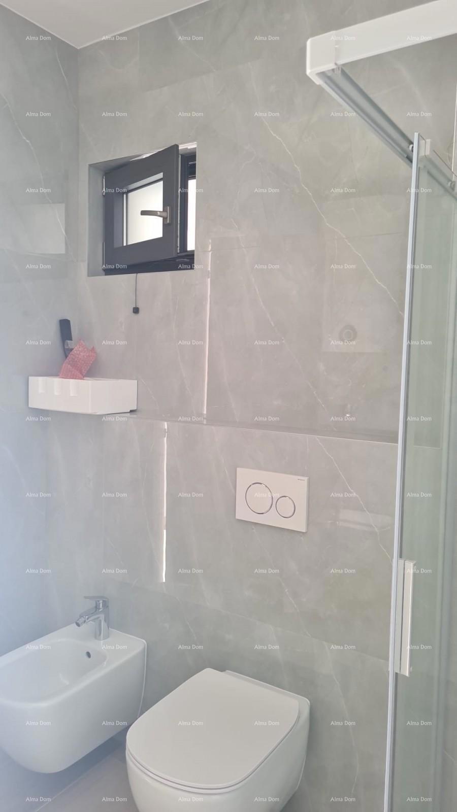 Moderen apartma v bloku A z vrtom in parkirnim mestom, blizu Umaga!