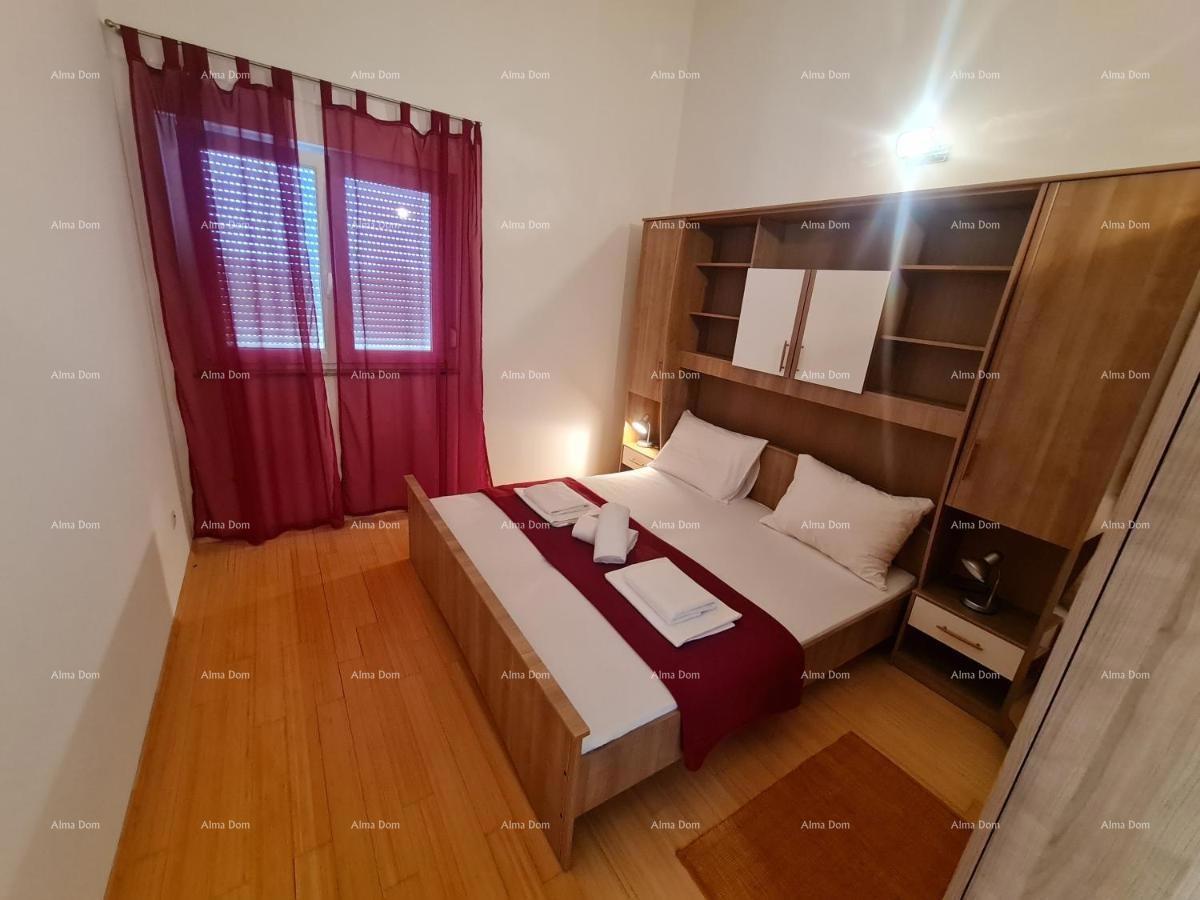 Prodaja velikega, lepo urejenega in popolnoma opremljenega apartmaja, s pogledom na morje, Ližnjan!