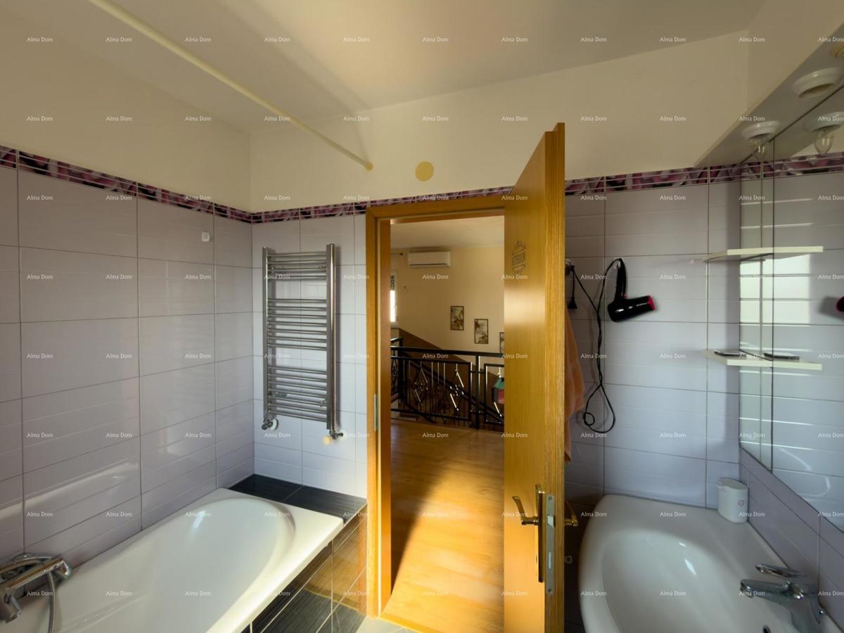 The translation of "Kuća sa dva stana" to Slovenian is "Hiša z dvema stanovanjem."