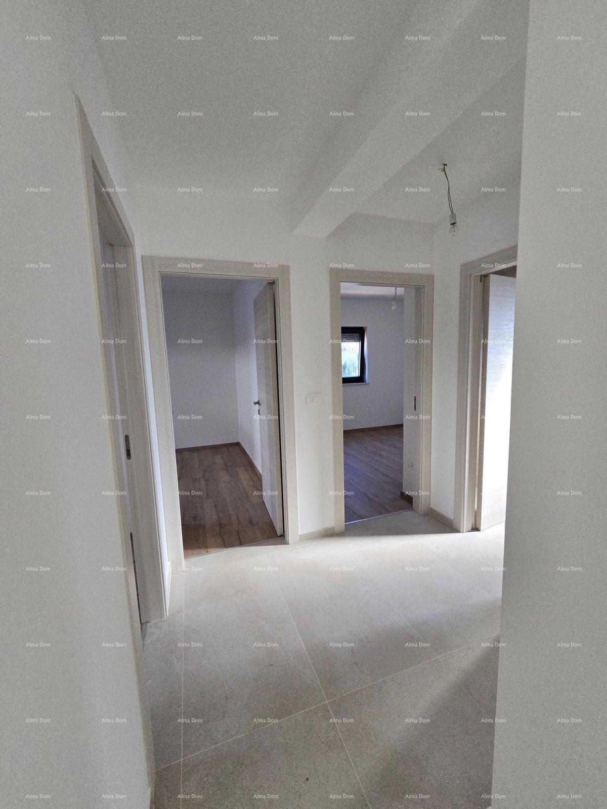 Trosobno stanovanje v 1. nadstropju novogradnje v bližini morja