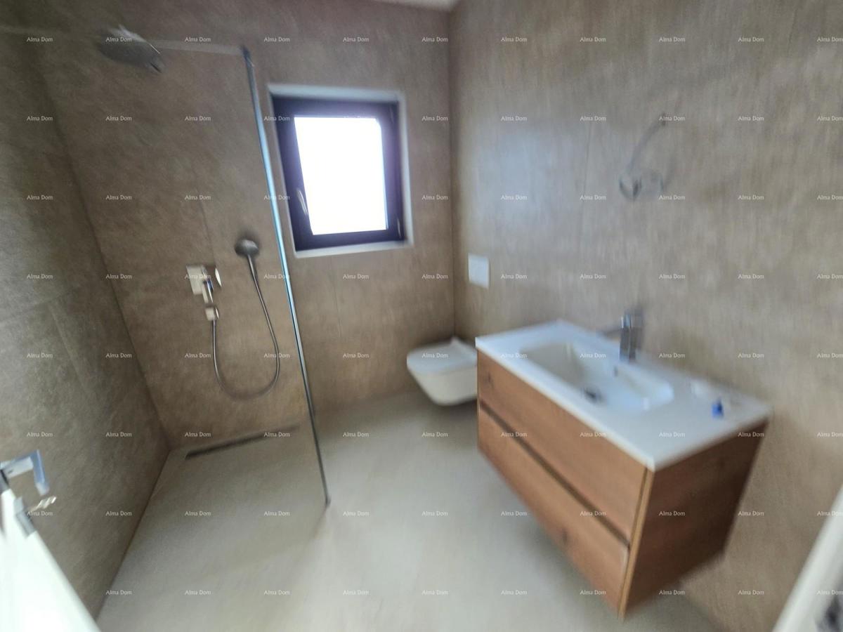 Trosobno stanovanje v 1. nadstropju novogradnje v bližini morja