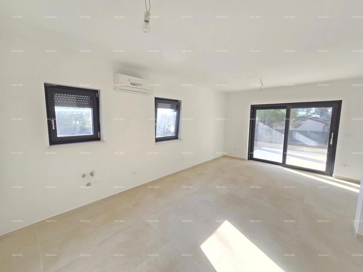 Trosobno stanovanje v 1. nadstropju novogradnje v bližini morja