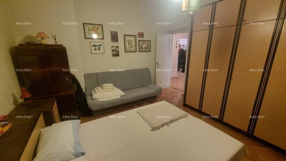 The translation of "Stan u centru Umaga" to Slovenian is "Stanovanje v centru Umaga."