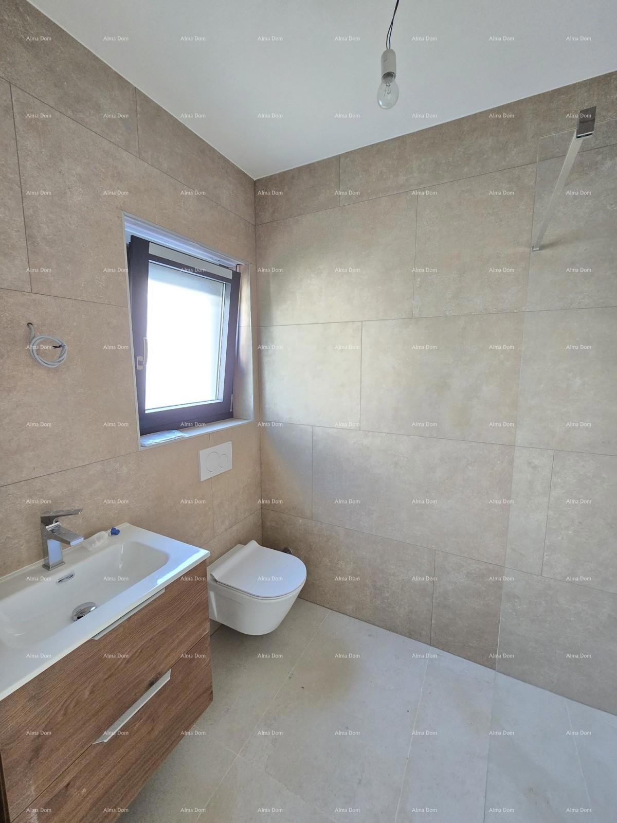 Trosobno stanovanje v 1. nadstropju novogradnje v bližini morja