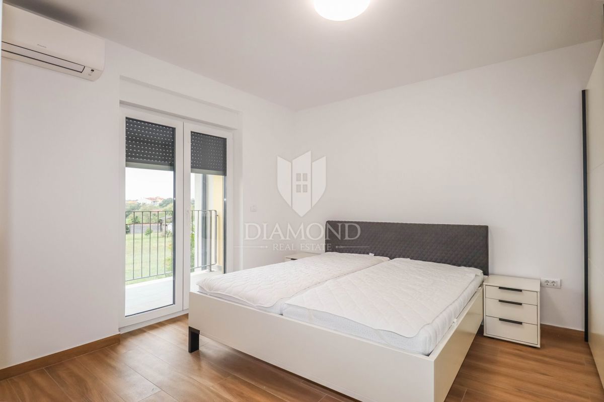 Stanovanje z vrtom in garažo na mirni lokaciji