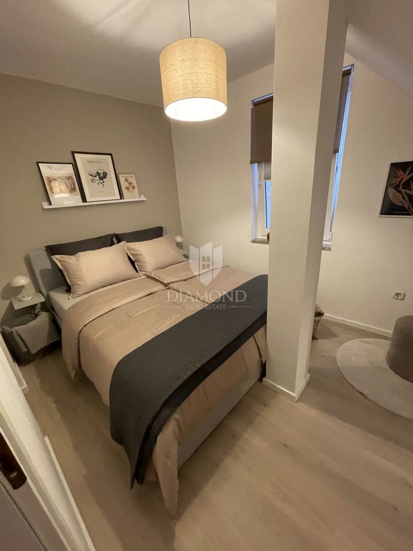 Dvoetažno stanovanje v središču mesta, tri spalnice, terasa, shramba