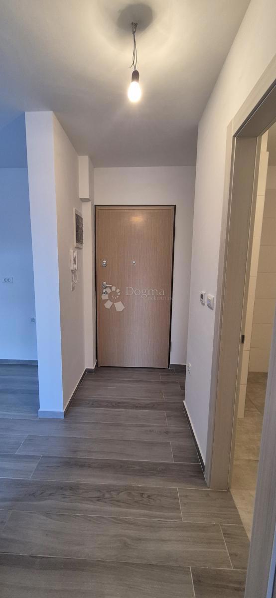 Dvosobno stanovanje v novogradnji 1 km od morja, površina 54,47 m2