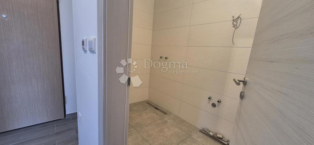 Dvosobno stanovanje v novogradnji 1 km od morja, površina 54,47 m2