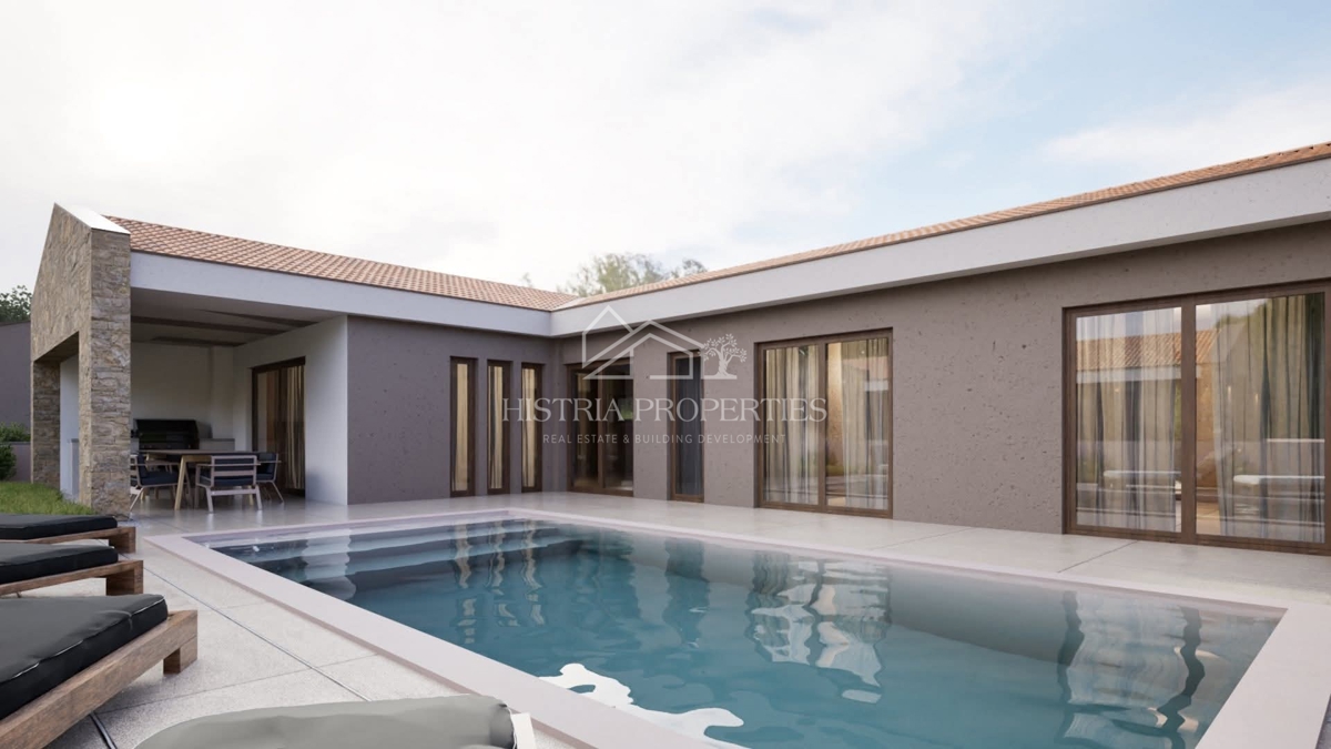 Moderno zasnovana enonadstropna hiša z bazenom in pomožnim poslopjem