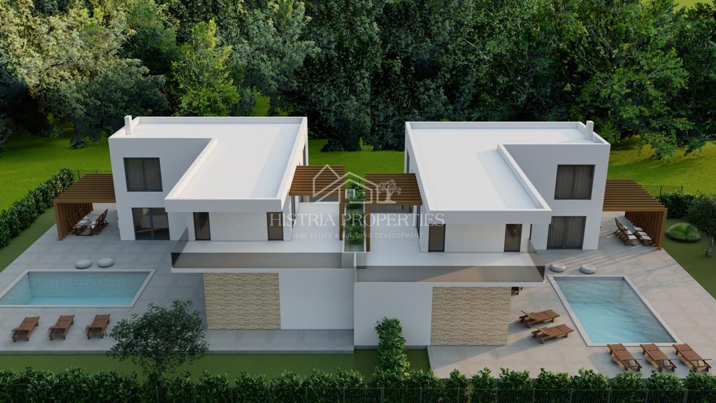 Gradbeno zemljišče za 2 moderni hiši z veljavnim dovoljenjem in plačanimi komunalnimi storitvami