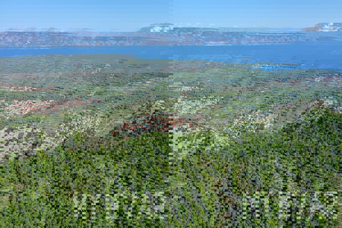 Zemljišče s panoramskim razgledom in hišo