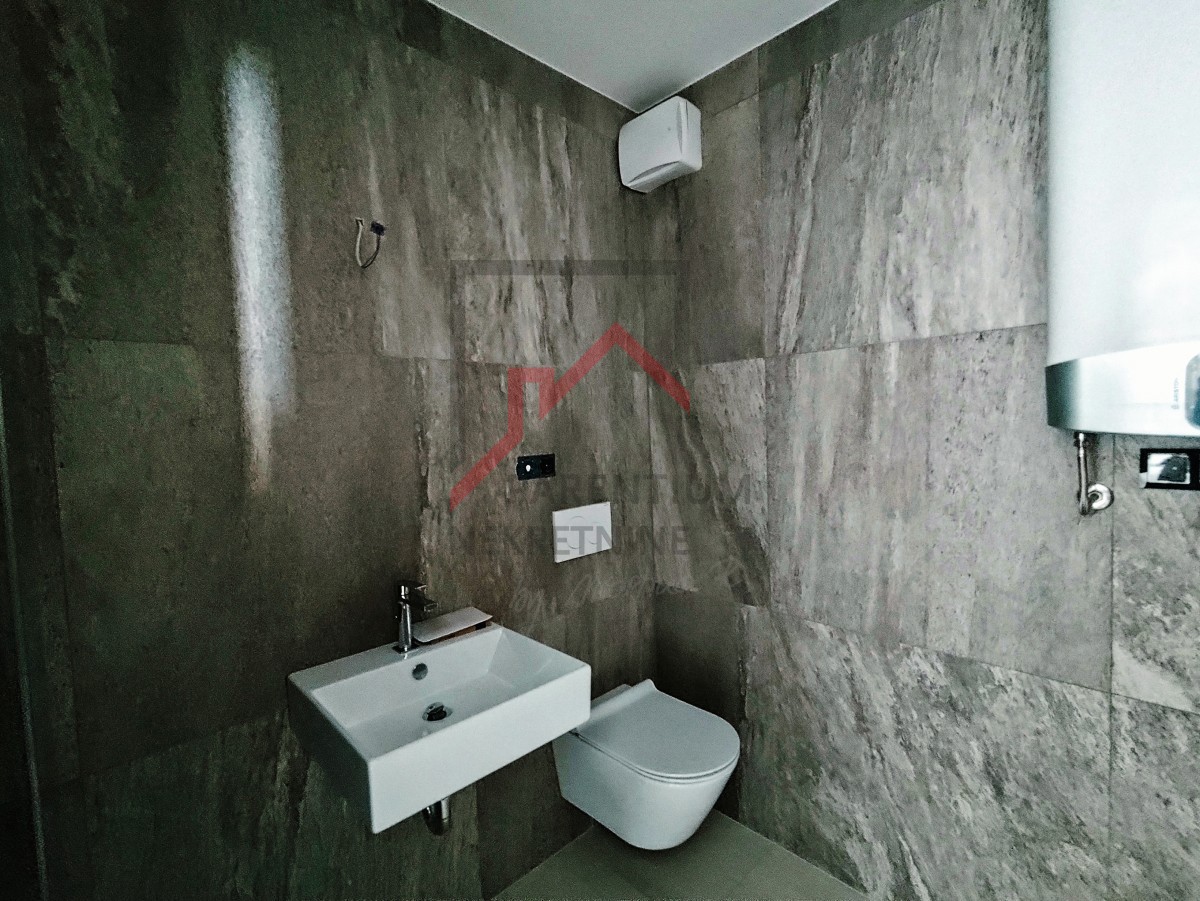 Istra, center Poreča - moderno dvosobno stanovanje z garažo v urbani novogradnji