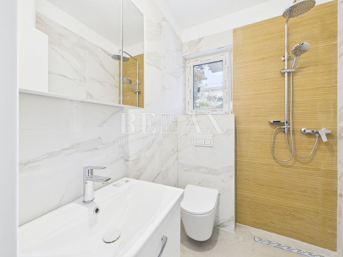 Povile - stanovanje v novogradnji, parkirišče, vrt